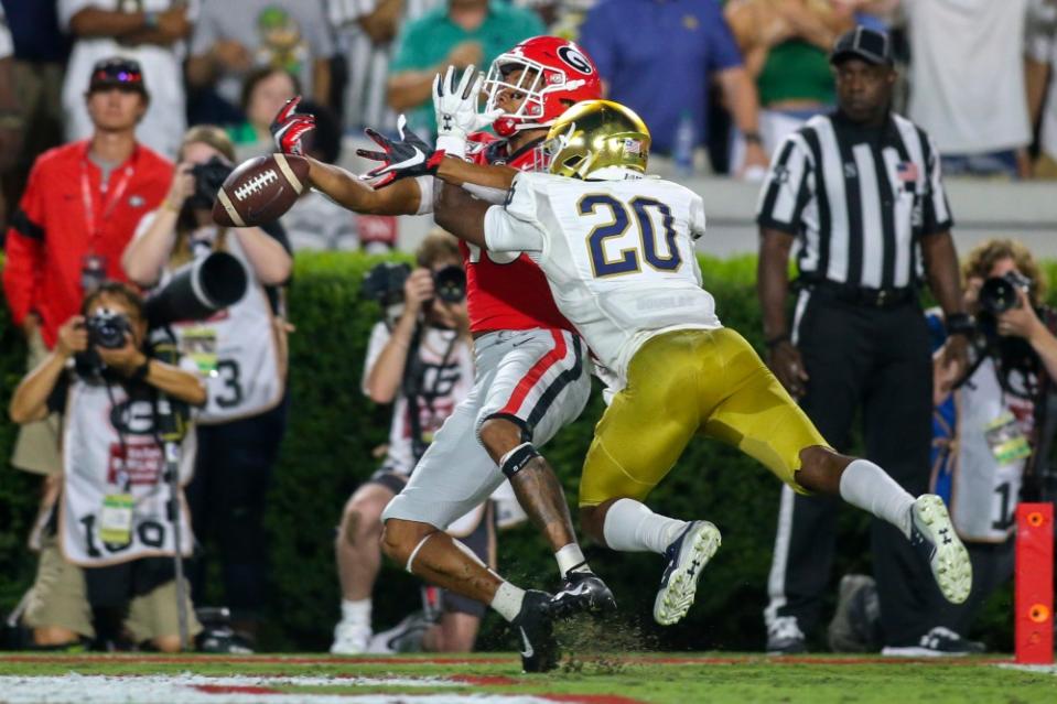 Sep 21, 2019; Athens, GA, USA; Notre Dame Fighting Irish cornerback Shaun Crawford (20) breaks up a pass intended for Georgia Bulldogs wide receiver Demetris Robertson (16) in the third quarter at Sanford Stadium. Mandatory Credit: Brett Davis-USA TODAY Sports