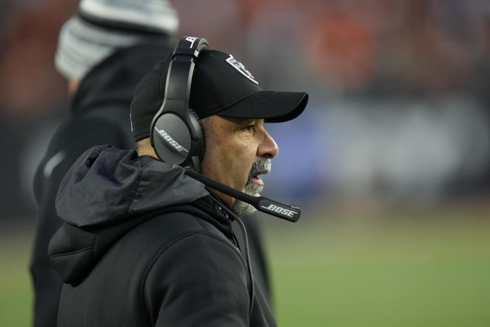 Las Vegas Raiders interim head coach Rich Bisaccia watches during the first half of an NFL wild-card playoff football game against the Cincinnati Bengals, Saturday, Jan. 15, 2022, in Cincinnati. (AP Photo/AJ Mast)