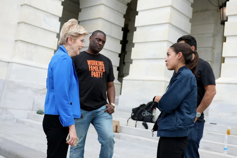 WASHINGTON, DC - AUGUST 03: Sen. Elizabeth Warren (D-MA) meets with (L-R) Rep. Mondaire Jones (D-NY), Rep. Cori Bush (D-MO), Rep. Jimmy Gomez (D-CA), and Rep. Alexandria Ocasio-Cortez (D-NY), near the entrance to the Capitol Building on August 03, 2021 in Washington, DC. News organizations reported that the Biden Administration plans to institute a new eviction moratorium for areas with high levels of Covid-19, days after Rep. Cori Bush (D-MO) started camping out on the front steps of the Capitol to protest the end of the CDC's original eviction moratorium. (Photo by Anna Moneymaker/Getty Images)