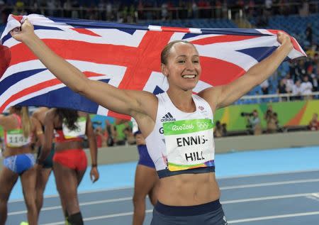 Aug 13, 2016; Rio de Janeiro, Brazil; Jessica Ennis-Hill (GBR) holds up a Great Britain flag after the women's heptathlon 800m event at Estadio Olimpico Joao Havelange during the Rio 2016 Summer Olympic Games. Mandatory Credit: Kirby Lee-USA TODAY Sports