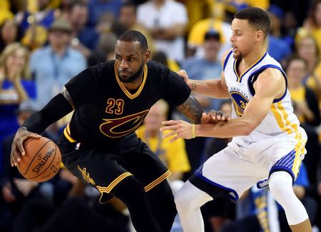 Jun 19, 2016; Oakland, CA, USA; Cleveland Cavaliers forward LeBron James (23) handles the ball against Golden State Warriors guard Stephen Curry (30) during the third quarter in game seven of the NBA Finals at Oracle Arena. Mandatory Credit: Bob Donnan-USA TODAY Sports