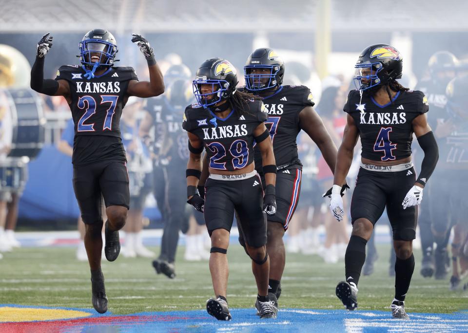 Players for the Kansas Jayhawks take the field before a game against Illinois on Friday, Sept. 8, 2023, in Lawrence, Kan. | Colin E. Braley, Associated Press