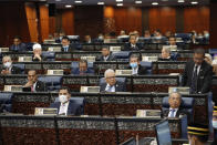 Prime Minister Muhyiddin Yassin attending parliament session at parliament lower house in Kuala Lumpur, Malaysia, Monday, July 13, 2020. (AP Photo/Vincent Thian)