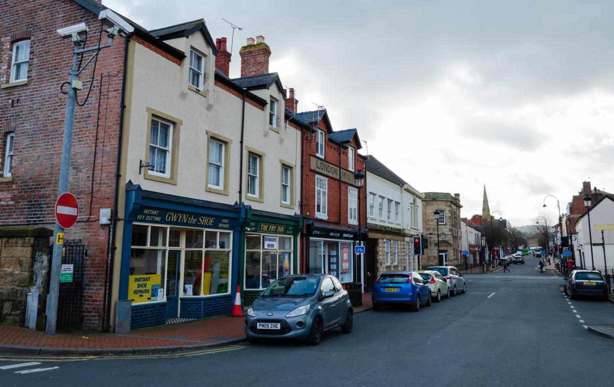 Flint, UK: Feb 11, 2020: A general street scene of the Welsh town of Flint. The view seen from close to the railway station is along High Street.