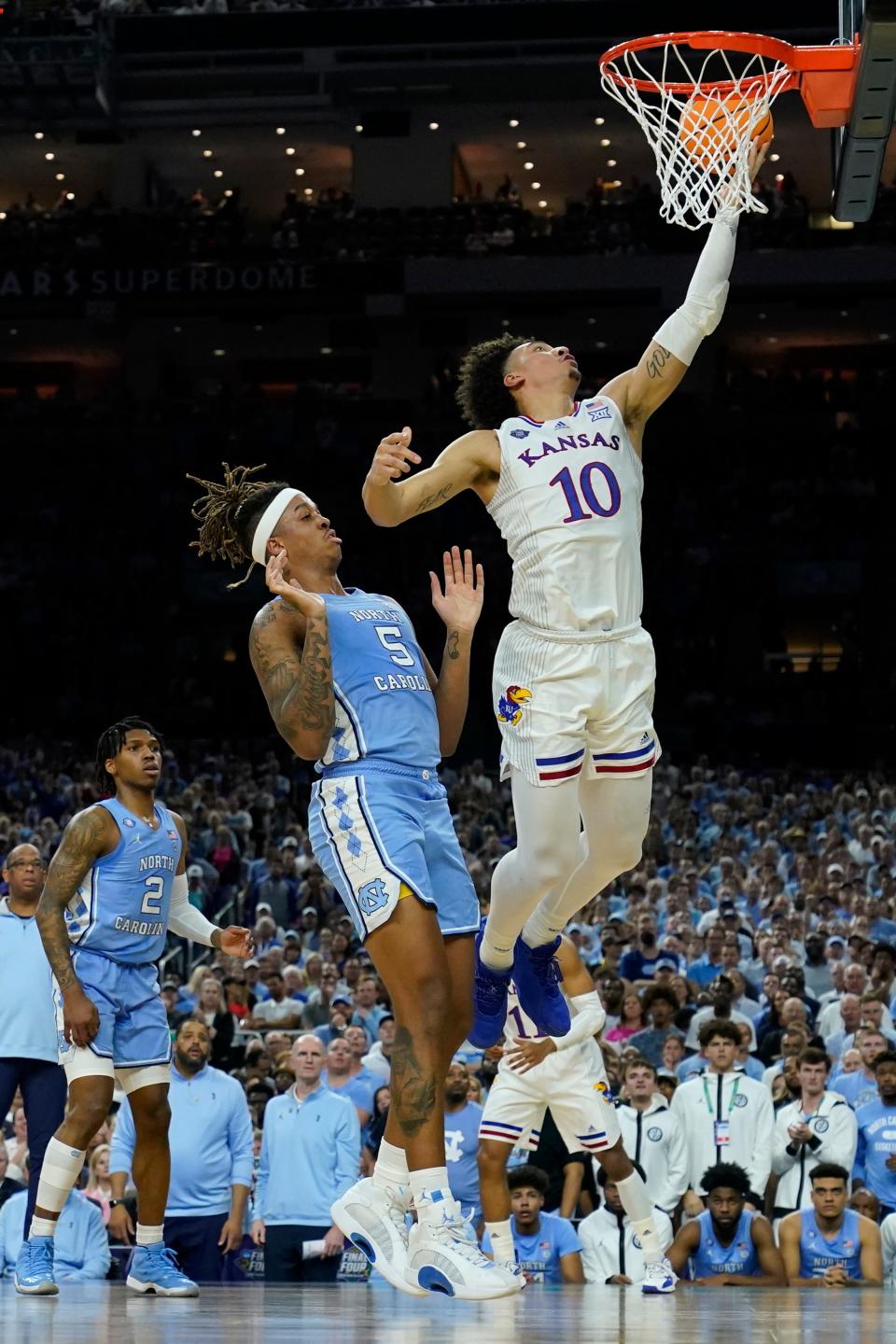 Kansas forward Jalen Wilson shoots over North Carolina forward Armando Bacot during the first half of the championship game of the NCAA tournament on April 4, 2022, in New Orleans.