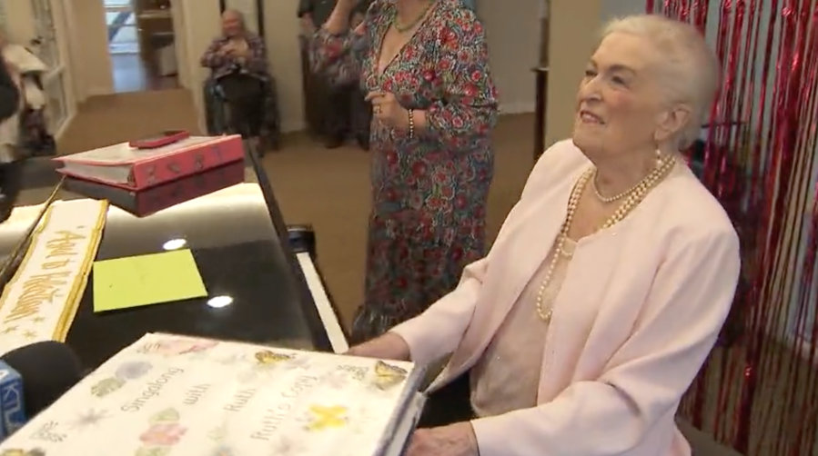 Ruth Allen, who turns 95 on Jan. 202, 2024, seen playing the piano and singing at Sunrise Senior Living on Jan. 18, 2024. (KTLA)