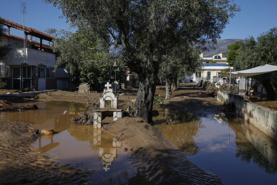A road is covered with mud after storms in Kineta village, about 68 kilometers (42 miles) west of Athens, Monday, Nov. 25, 2019. Authorities in Greece say two people have died and hundreds of homes have been flooded following an overnight storm that affected areas west of Athens. (AP Photo/Petros Giannakouris)