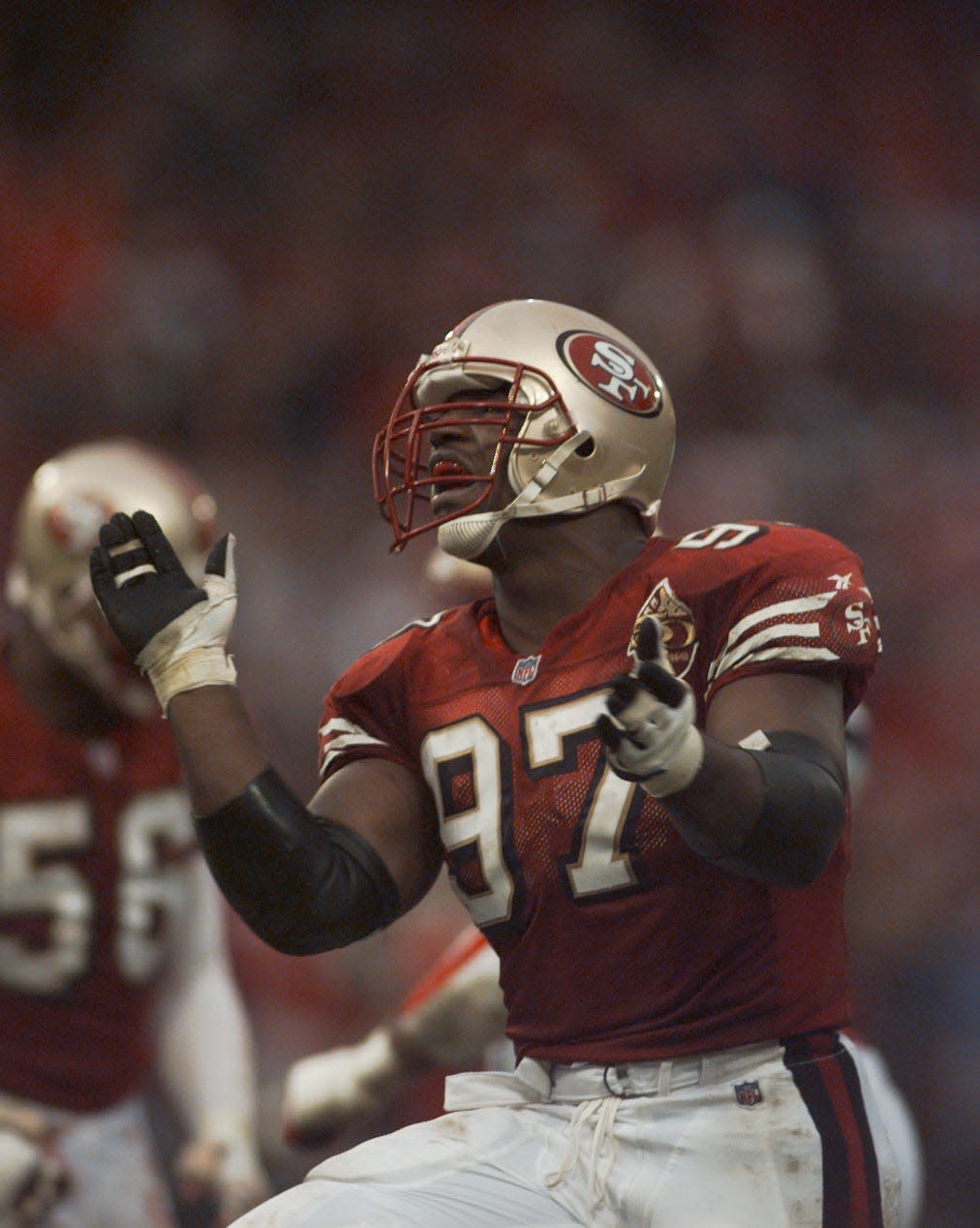 Bryant Young celebrates after a play in an undated photo.