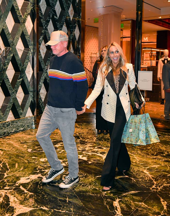 Dominic Purcell and Tish Cyrus walking hand-in-hand