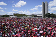 Supporters of Luiz Inacio Lula da Silva gather to attend his inauguration as new president outside the Planalto presidential palace in Brasilia, Brazil, Sunday, Jan. 1, 2023. (AP Photo/Silvia Izquierdo)