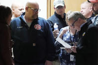 Ohio Governor Mike DeWine, right, prepares to meet with reporters after touring the Norfolk and Southern train derailment site in East Palestine, Ohio, Monday, Feb. 6, 2023. (AP Photo/Gene J. Puskar)