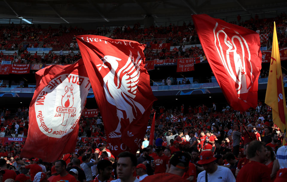 Liverpool fans wave flags in the stands before the UEFA Champions League Final at the Wanda Metropolitano, Madrid.