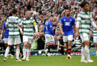 Rangers' John Lundstram, centre, leaves the pitch after being shown a red card for a foul on Celtic's Alistair Johnston, during the Scottish Premiership soccer match between Glasgow Rangers and Celtic Glasgow, at the Celtic Park, in Glasgow, Scotland, Saturday May 11, 2024. (Jane Barlow/PA via AP)