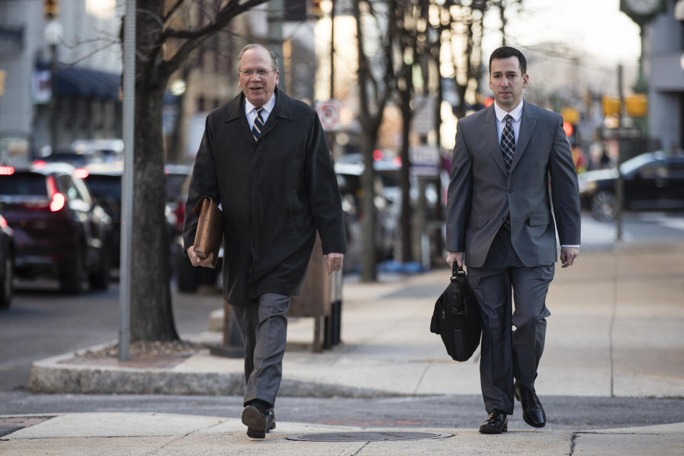 Chief Trial Deputy at Allegheny County District Attorney's Office Dan Fitzsimmons, left, and along with Assistant District Attorney Jonathan Fodi arrive for jury selection in former East Pittsburgh police officer Michael Rosfeld's trial who is accused of shooting to death a black teenager Antwon Rose II as he ran from a vehicle last year, at the Dauphin County Courthouse in Harrisburg, Pa., Tuesday, March 12, 2019. (AP Photo/Matt Rourke)
