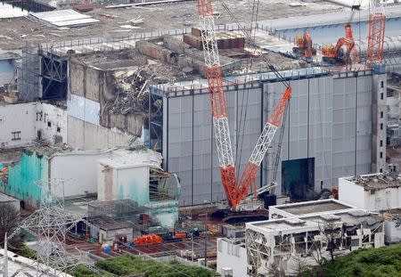 FILE PHOTO: An aerial view shows the No.3 reactor building at Tokyo Electric Power Co. (TEPCO)'s tsunami-crippled Fukushima Daiichi nuclear power plant in Fukushima Prefecture, in this photo taken by Kyodo July 18, 2013. Mandatory credit Kyodo/via REUTERS/File photo