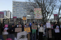 Nurses of the nearby St. Thomas' Hospital stand on the picket line, in London, Monday, Feb. 6, 2023. Tens of thousands of nurses and ambulance staff walked off the job in the U.K. Monday in what unions called the biggest strike in the history of Britain’s public health system. (AP Photo/Frank Augstein)