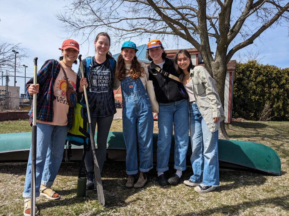 This group of UVM seniors took to the water in a canoe to avoid the crowds at Waterfront Park in Burlington, Vermont, on eclipse day, Monday, April 8, 2024.