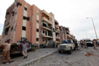 Libyan forces allied with the U.N.-backed government gather in front of ruined buildings at the eastern frontline of fighting with Islamic State militants, in Sirte's neighbourhood 650, Libya, October 21, 2016. REUTERS/Ismail Zitouny