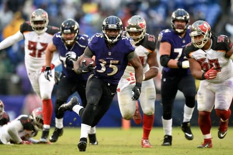 Baltimore Ravens running back Gus Edwards (35) rushes the ball in the second half of an NFL football game against the Tampa Bay Buccaneers - Credit: AP Photo/Gail Burton