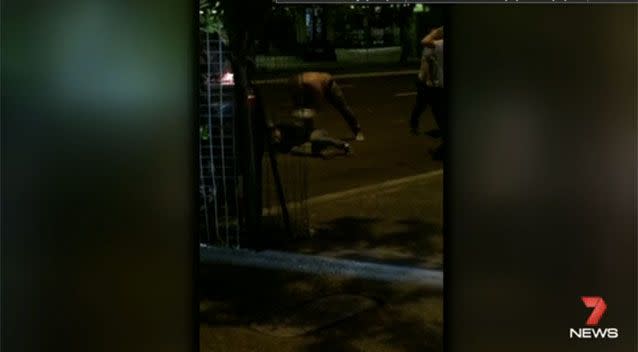 One of the attackers caught on CCTV taunting his victim. Source: 7News