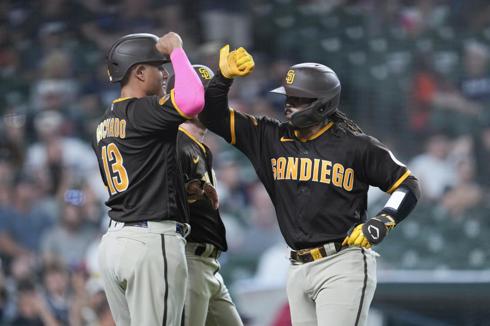 San Diego Padres' Luis Campusano, right, celebrates his three-run home run with Manny Machado, left, against the Detroit Tigers in the eighth inning of a baseball game, Saturday, July 22, 2023, in Detroit. (AP Photo/Paul Sancya)