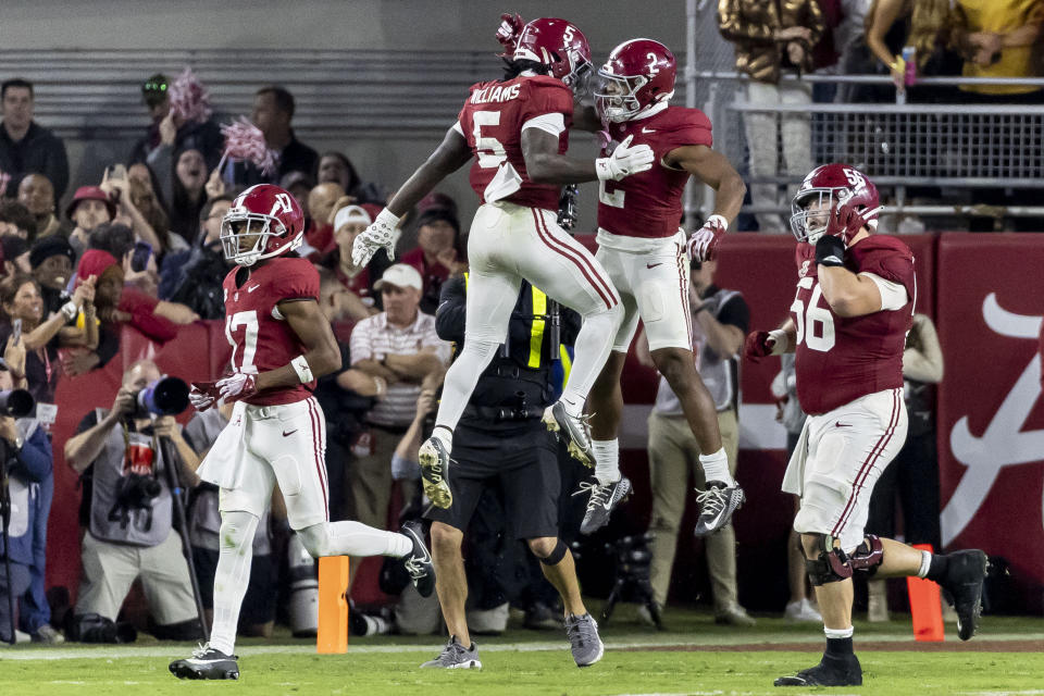 Alabama running back Roydell Williams (5) celebrates with running back Jase McClellan (2) after McClellan's touchdown run during the second half of an NCAA college football game against LSU, Saturday, Nov. 4, 2023, in Tuscaloosa, Ala. (AP Photo/Vasha Hunt)