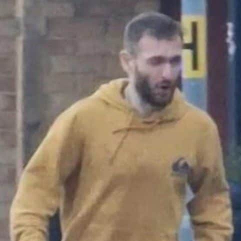 A man in a yellow hoody was arrested at the scene on Tuesday