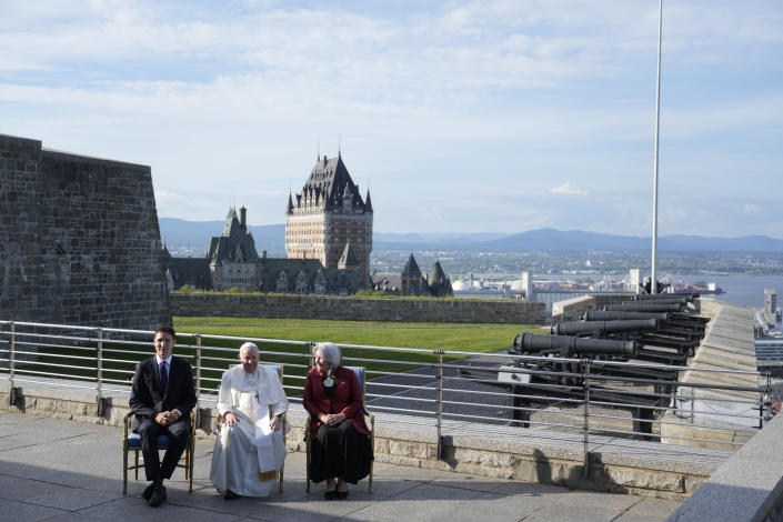 Pope Francis is flanked by Canadian Prime Minister Justin Trudeau, left, and Governor-General Mary Simon, at the Citadelle de Quebec, Wednesday, July 27, 2022. Pope Francis is on a "penitential" six-day visit to Canada to beg forgiveness from survivors of the country's residential schools, where Catholic missionaries contributed to the "cultural genocide" of generations of Indigenous children by trying to stamp out their languages, cultures and traditions. (AP Photo/Gregorio Borgia)