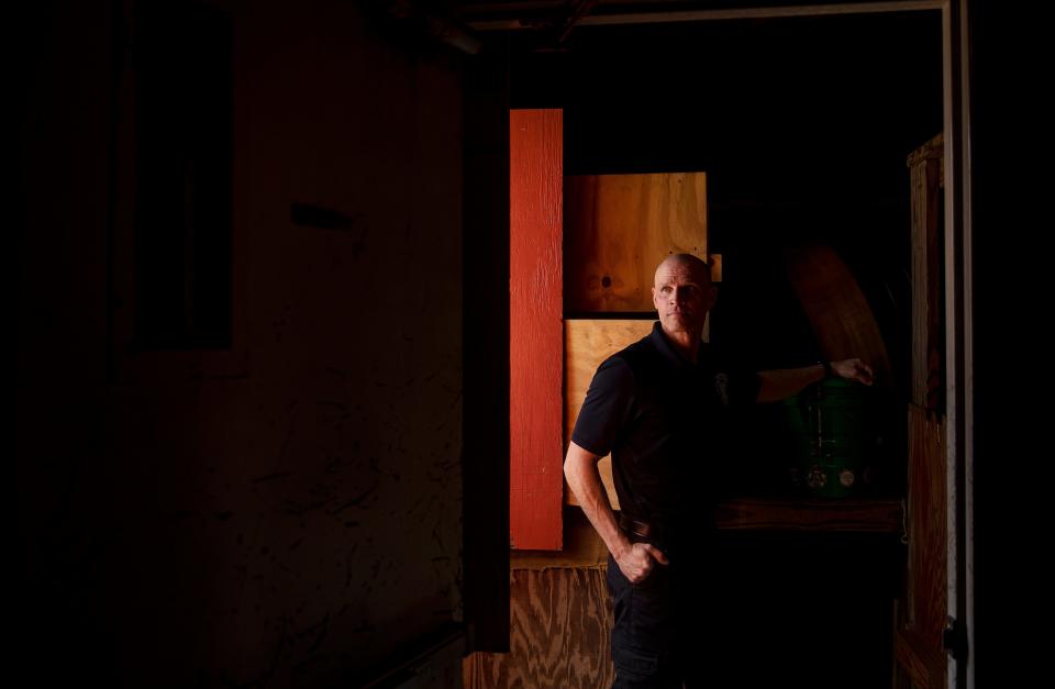 David Perez, an Engineer/Paramedic for the North Collier Fire Department stands for a portrait at the headquarters in Naples on Tuesday, March 12, 2024. Since 2020, Perez has been diagnosed with two forms of cancer, multiple myeloma and mantle cell lymphoma. The diagnoses are on the list cancers that are associated with being a firefighter according a bill that Gov. Ron DeSantis signed into law in 2019. He became in cancer free in Sept. 2023. He attributes his recovery with a healthy mindset, a strict exercise regime, a healthy diet and the use of a sauna along with traditional cancer treatments. He is currently not actively fighting fires, but is educating colleagues on cancer safety.