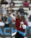 Carolina Panthers' Cam Newton (1) throws a pass during an NFL football practice at their training camp in Spartanburg, S.C., Saturday, July 26, 2014. (AP Photo/Chuck Burton)