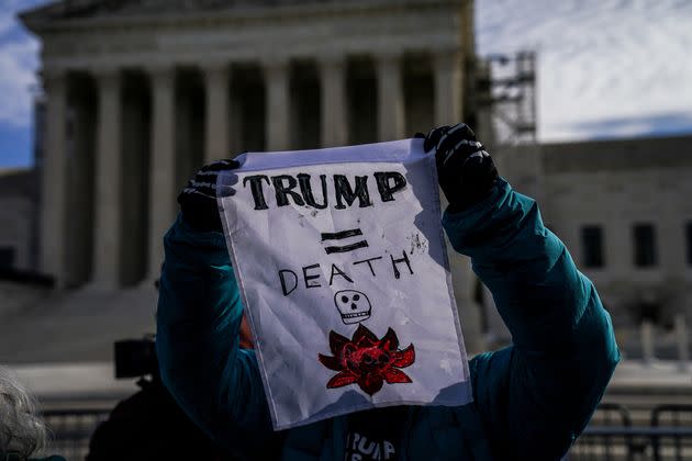 Demonstrators call for Trump to be kept from becoming president again as the Supreme Court heard oral arguments Thursday in a case involving the Colorado ballot.
