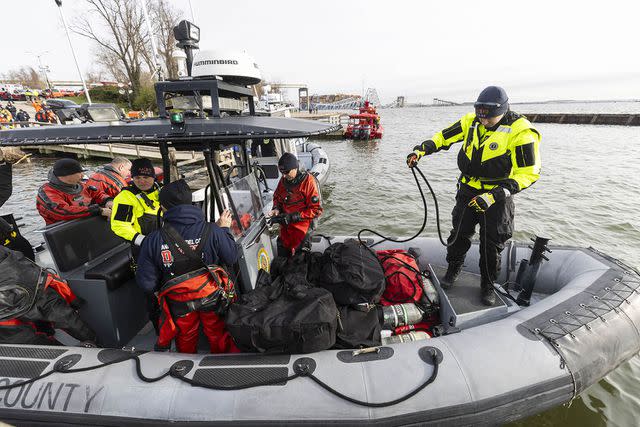 <p>JIM LO SCALZO/EPA-EFE/Shutterstock</p> Rescue personnel on March 26