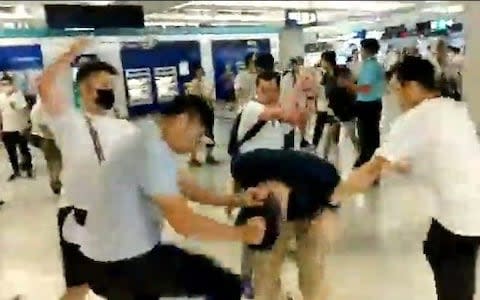 Video footage showed attacks by the men on demonstrators at Yuen Long train station - Credit: The Stand News/Reuters