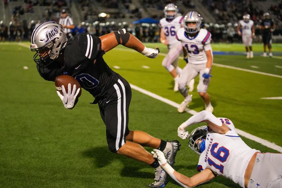 Hilliard Bradley's Ethen Tebbetts breaks away from Marysville's Jake Fisher (16) on Sept. 8.