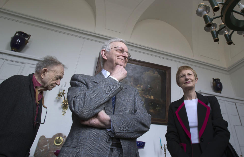 In this photo taken Friday, March 22, 2013, U.S. filmmaker Fred Wiseman, left, Britain's Michael Edwards, center, and New Zealand's Ambassador to France, Rosemary Banks, attend the 21st annual poetry recitation competition as jury members at the Maison d'Education de la Legion d'Honneur in Saint Denis, north of Paris. The man who will soon become the newest official guardian of the French language has spoken: English, he says, is jumping the barricades and threatening the language of Moliere. Edwards should know. He's British - the first to become one of the 40 esteemed “immortals” of the Academie Francaise, the institution that has watched over the French language since 1635. (AP Photo/Michel Euler)