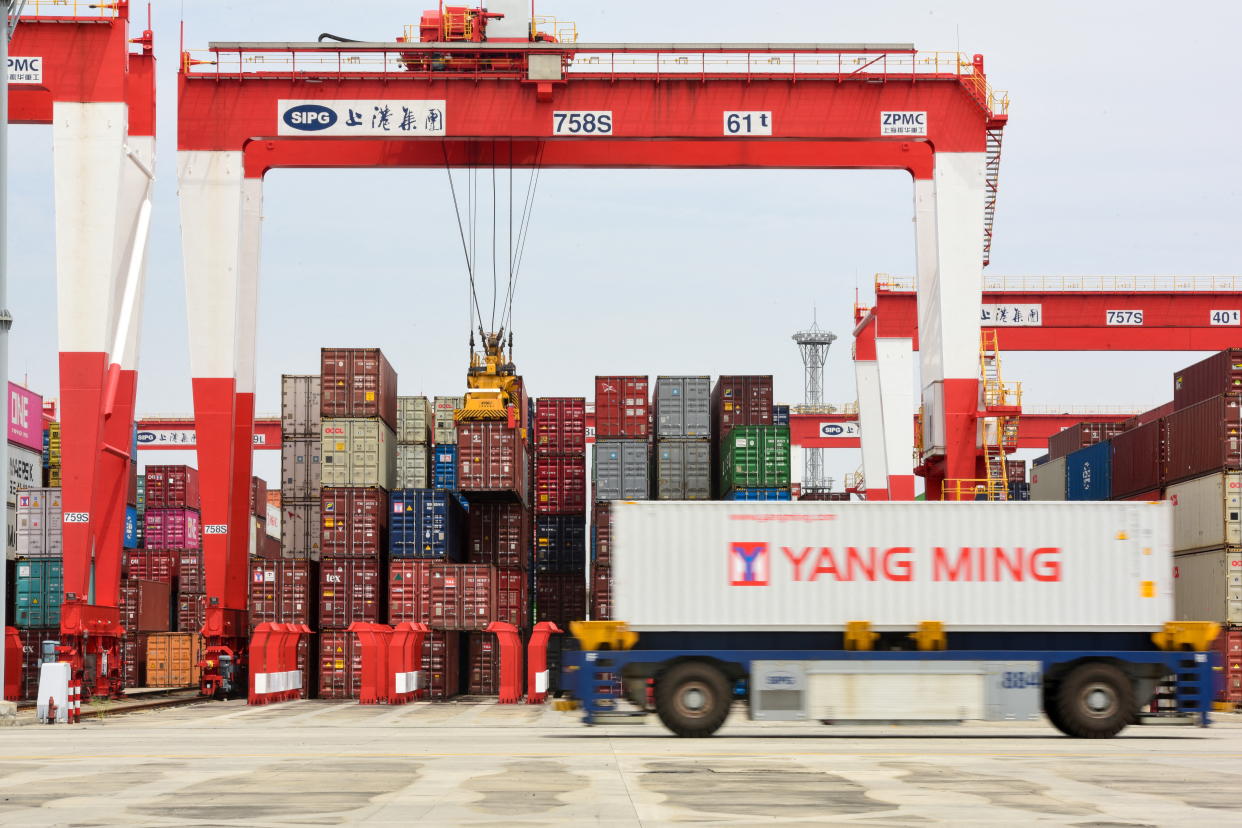 An automated guided vehicle (AGV) transports a container at the Yangshan Deep Water Port amid the coronavirus disease (COVID-19) outbreak in Shanghai, China April 27, 2022. Picture taken April 27, 2022. cnsphoto via REUTERS  