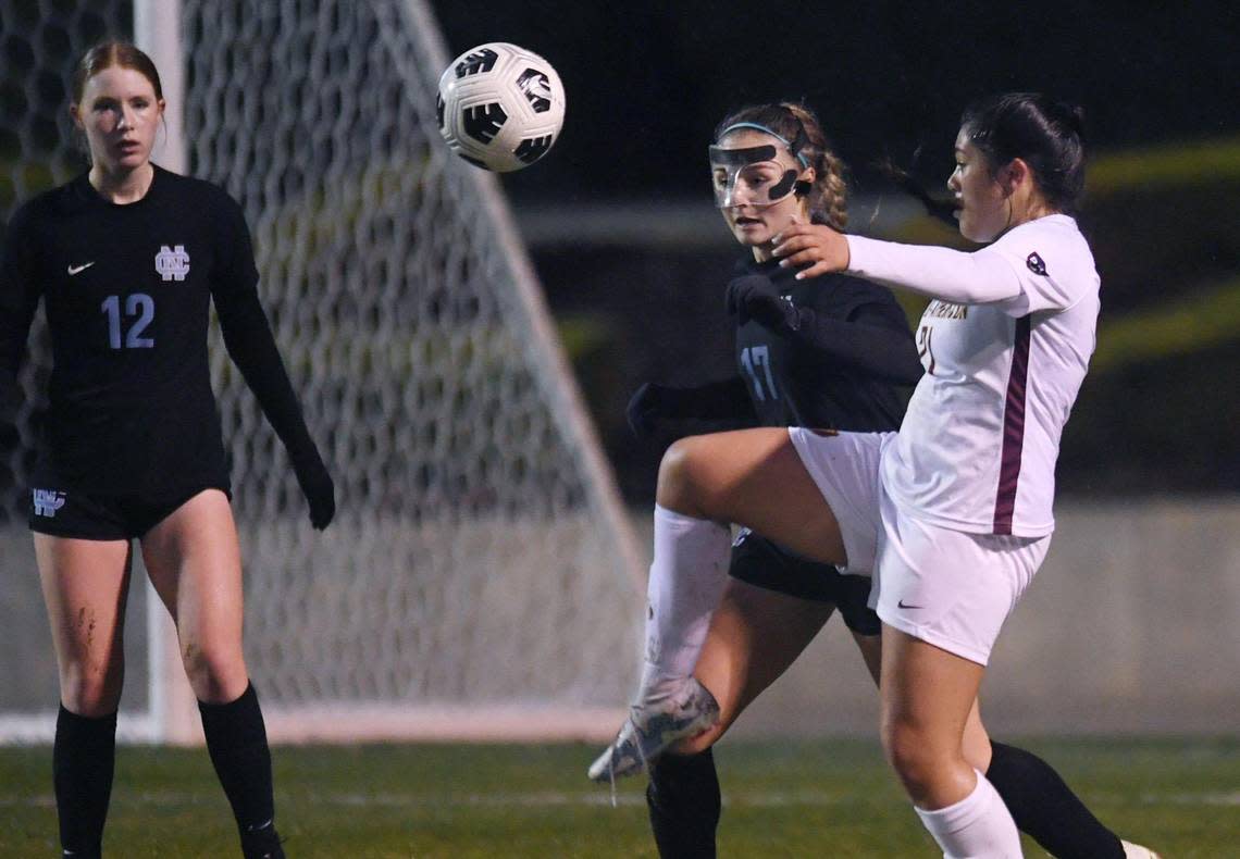 Menlo-Atherton’s Valerie Latu-Nava, right, with Clovis North’s Shae Kuntz to the left in the CIF Northern California Regional girls playoff game action Tuesday, Feb. 2, 2023 in Clovis. Menlo-Atherton defeated Clovis North 1-0.