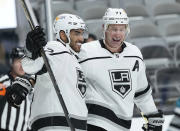 Los Angeles Kings left wing Andreas Athanasiou (22) celebrates with center Jeff Carter (77) after scoring a gaol against the San Jose Sharks during the second period of an NHL hockey game Saturday, April 10, 2021, in San Jose, Calif. (AP Photo/Tony Avelar)