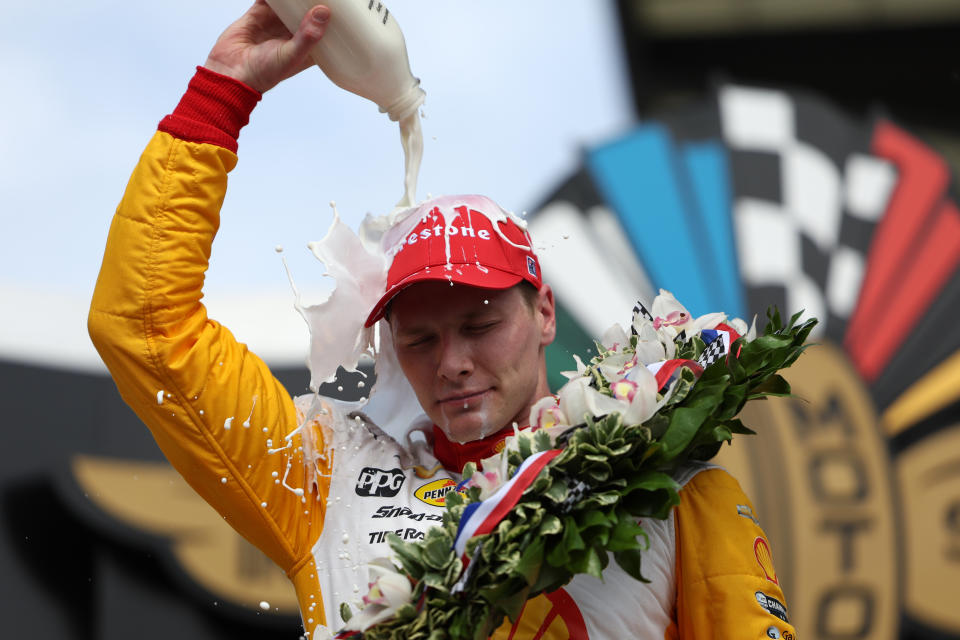 INDIANAPOLIS, INDIANA - MAY 28: Josef Newgarden, driver of the #2 PPG Team Penske Chevrolet, celebrates by pouring milk on his head after winning  the 107th Running of Indianapolis 500 at Indianapolis Motor Speedway on May 28, 2023 in Indianapolis, Indiana. (Photo by James Gilbert/Getty Images)