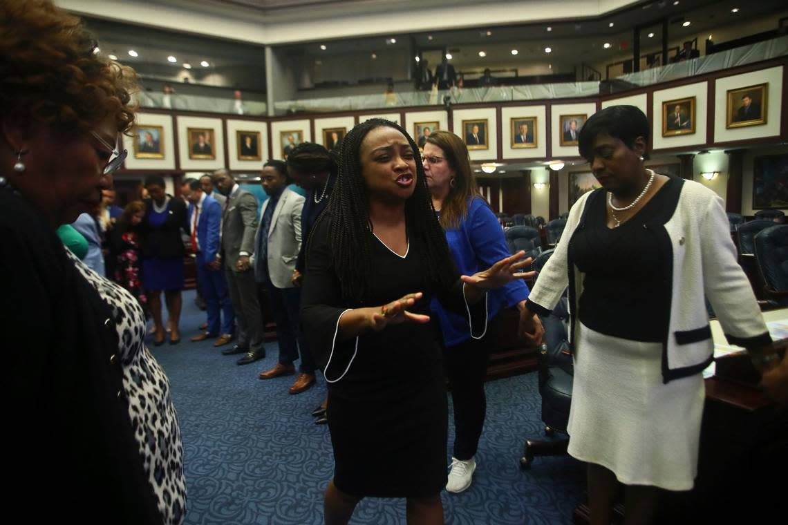 Rep. Dotie Joseph, D-North Miami, leads fellow Democrat protesters in prayer as debate stops on Senate Bill 2-C: Establishing the Congressional Districts of the State in the House of Representatives Thursday, April 21, 2022 at the Capitol in Tallahassee, Fla.