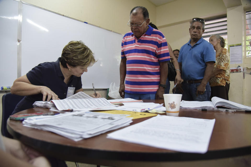 FILE - Puerto Rico residents line up to vote during the U.S. territory's Democratic primary election in San Juan, Puerto Rico, June 5, 2016. Puerto Rico will hold a Democratic presidential primary Sunday, April 28, 2024, the only opportunity for Democrats on the island to officially weigh in on the race for the White House. Puerto Rico can't vote in the general election but may participate in presidential primaries and send delegates to both national conventions this summer. President Joe Biden has already unofficially clinched the nomination and faces minimal opposition on the ballot. (AP Photo/Carlos Giusti, File)