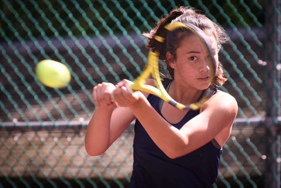 Laura Egan of Chatham returns a ball with a backhand in the1st singles during the Morris County Tournament girls tennis final at County College of Morris in Randolph on 09/26/21. 