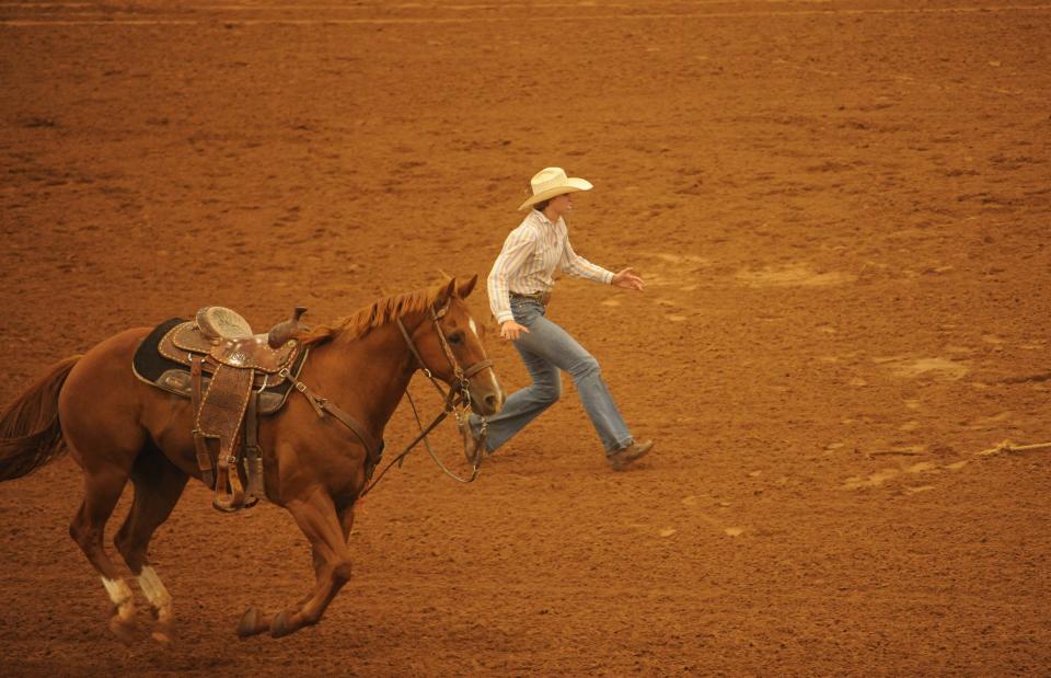 Uvalde's Maddie Aasbo competes in goat tying at the Texas High School Finals Rodeo.