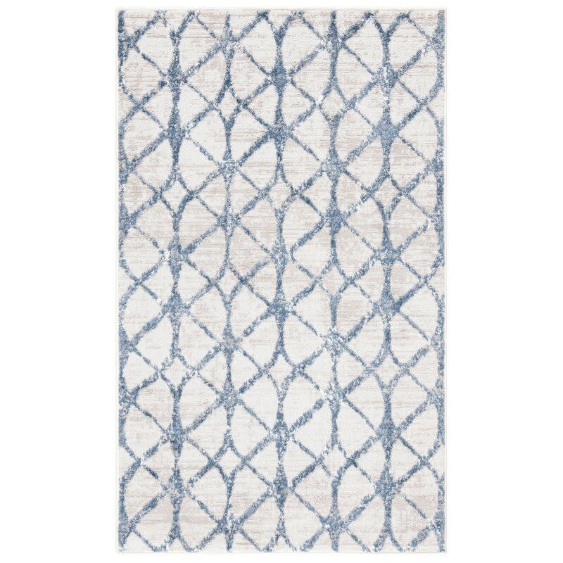 <p><a href="https://go.redirectingat.com?id=74968X1596630&url=https%3A%2F%2Fwww.wayfair.com%2F--%2Fpdp%2Fbreakwater-bay--shellie-geometric-blue-area-rug-x211187125-l167-w005061217.html&sref=https%3A%2F%2F" rel="nofollow noopener" target="_blank" data-ylk="slk:Shop Now;elm:context_link;itc:0;sec:content-canvas" class="link ">Shop Now</a></p><p>Shellie Geometric Area Rug</p><p>wayfair.com</p><p>$157.99</p><span class="copyright">Wayfair</span>