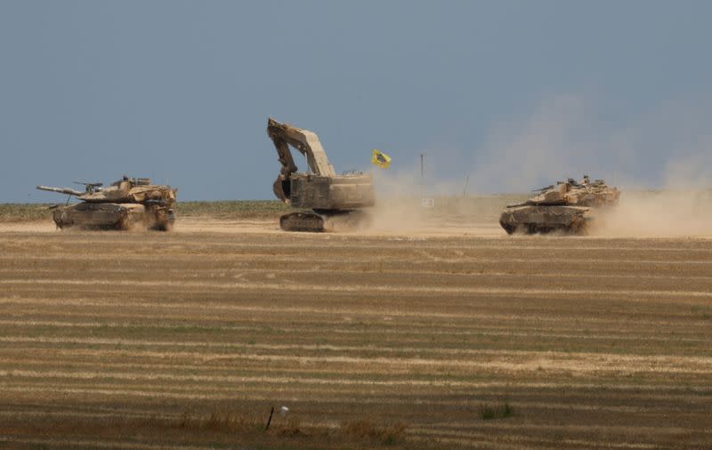 Israeli tanks manoeuvre near the Israel-Gaza Border