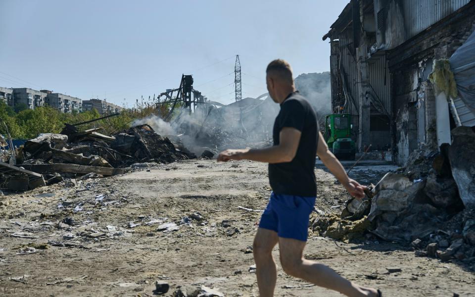 A local resident reacts after Russian strike near his home in Kramatorsk