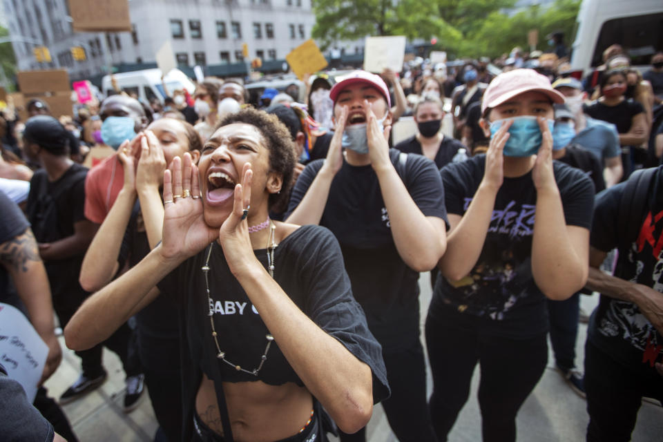 FILE - Protesters demonstrate against the the death of George Floyd, a black man who was in police custody in Minneapolis, Friday, May 29, 2020, in New York. The massive protests sweeping across U.S. cities following the police killing of a black man in Minnesota have elevated fears of a new surge in cases of the coronavirus. Images showing thousands of screaming, unmasked protesters have sent shudders through the health community, who worry their calls for social distancing during the demonstrations are unlikely to be heard. (AP Photo/Mary Altaffer)