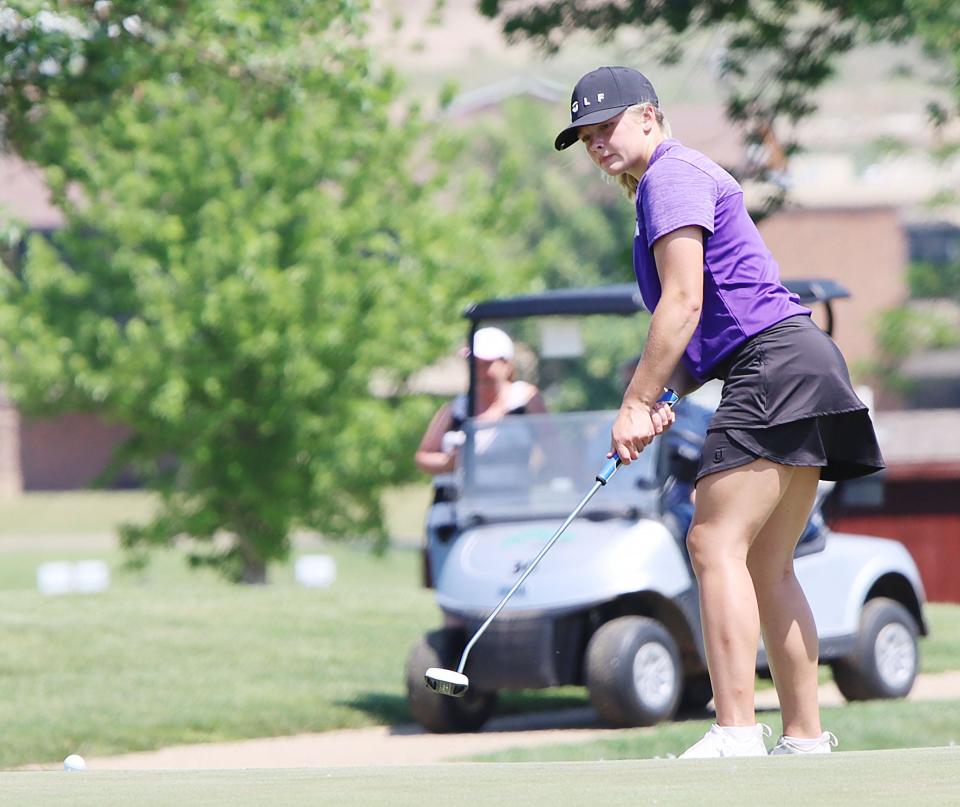 Shelby Pearson of Watertown putts on No.  14 during the opening day of the state Class AA girls golf tournament on Monday, June 5, 2023 at the Hillsview Golf Course in Pierre.