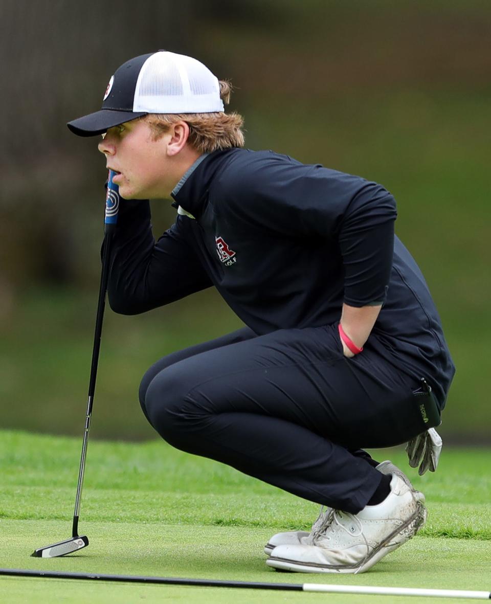 Kent Roosevelt's Liam Curtis reads the green on the 6th hole during the Suburban League golf tournament at J.E. Good Park Golf Course, Thursday, Sept. 29, 2022, in Akron, Ohio.