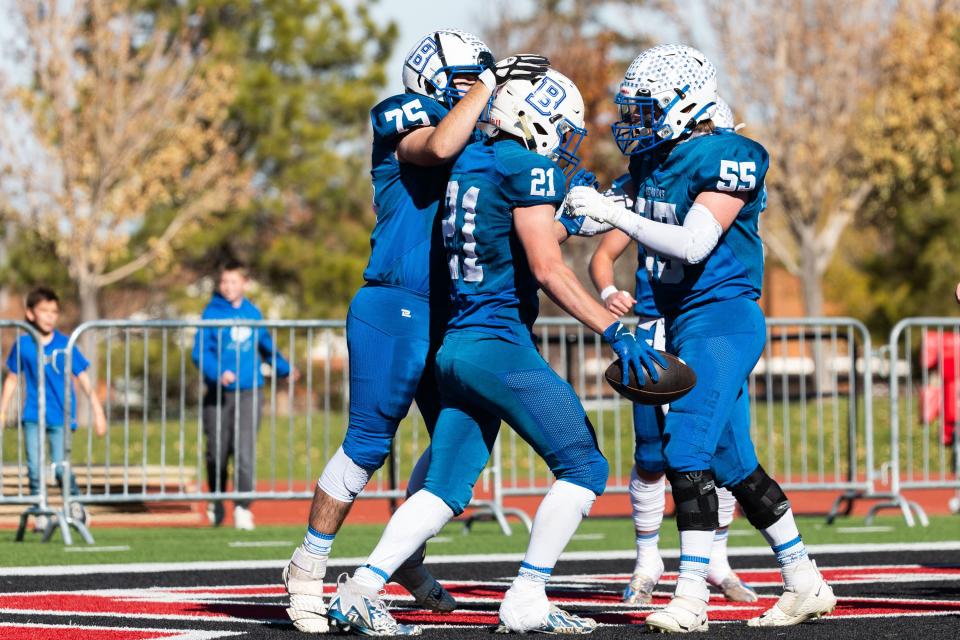 Left to right, Beaver High School’s Braxton Holgreen, Tavyn Hollinghsead, and Braden Laws celebrate Hollinghsead’s touchdown during the 1A football state championship game against Enterprise High School at Southern Utah University in Cedar City on Saturday, Nov. 11, 2023. | Megan Nielsen, Deseret News